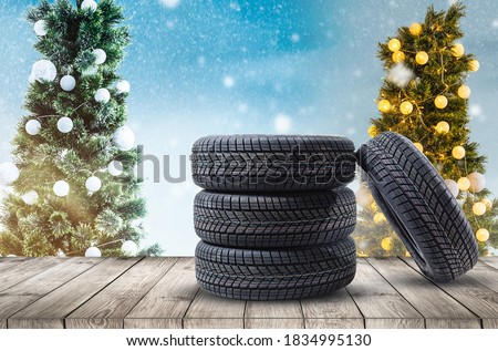 wheel rubber gift for Christmas on the wood textured backgrounds in a christmas interior