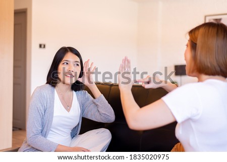 Asian woman patient deaf hearing talking with specialist sign language and showing hands gesture,International Day of Sign Languages Royalty-Free Stock Photo #1835020975