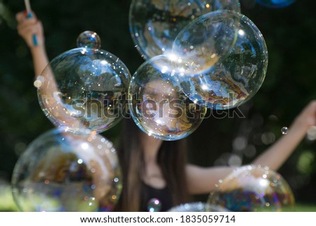 Soap bubbles fly in the air. Show and entertainment for children. Selective focus.