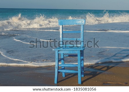 Seascape with a chair. The concept of a holiday by the sea.