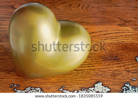 golden heart in a shabby wooden style background
