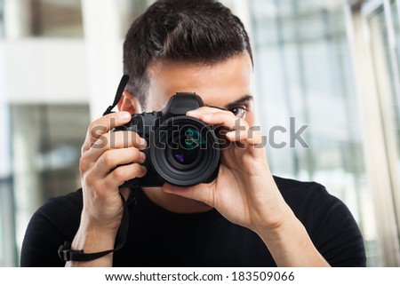 Photographer using his camera