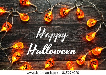 Happy Halloween alphabet letter on wooden  background