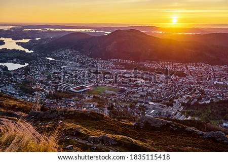 An aerial view of the city valley. October sunset on Mount Ulriken in Bergen, Norway