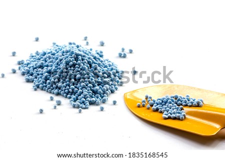 A heap of composite mineral fertilizers and chemical fertilizer in shovel isolated on the white background, Nitrogen (N), Phosphorus (P), Potassium (K) or NPK for plants, Minerals used in agriculture Royalty-Free Stock Photo #1835168545