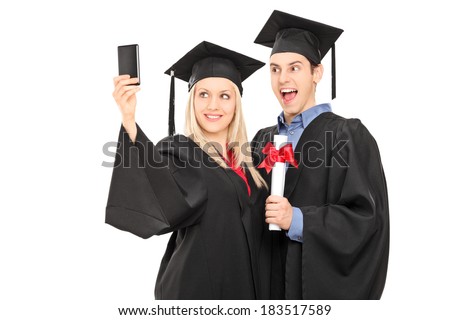 Male and female graduate students taking a selfie isolated on white background