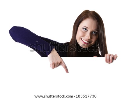 Woman showing and pointing at blank billboard sign banner, young smiling brunette, isolated on white background
