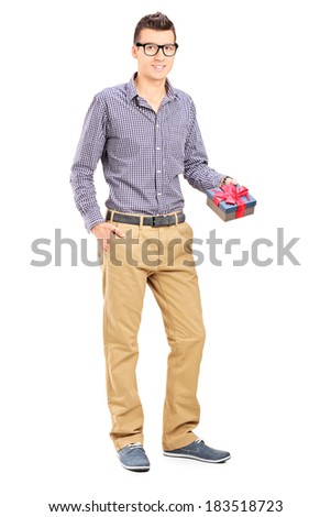 Full length portrait of a man holding a present isolated on white background