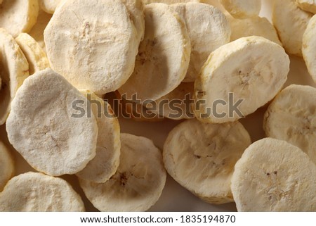 Pile of sweet dehydrated banana slices.
