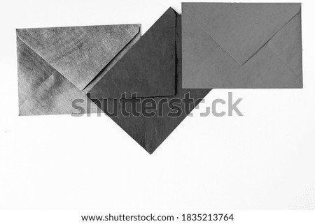Three envelope on the white background, black and white photo