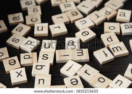 Wooden letters isolated on wooden background