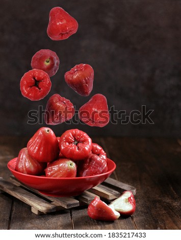 Flying guava, isolated on dark background.