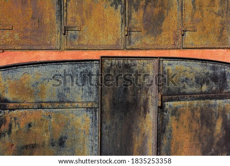 Old rusted metal doors on a factory. Beautiful rustic texture