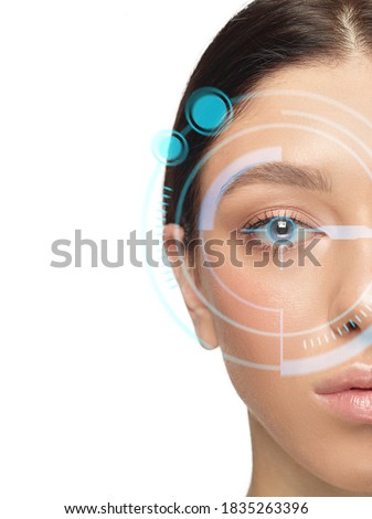 Future woman with cyber technology eye panel, cyberspace interface, ophthalmology concept. Beautiful female eye with modern identification tech, medical treatment for eyes, focus. Copyspace. Royalty-Free Stock Photo #1835263396