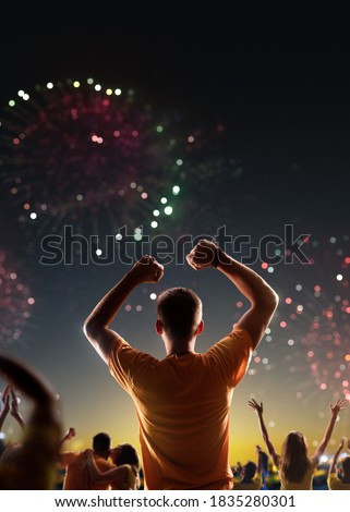 Fans celebrate in Stadium Arena night fireworks High quality photo