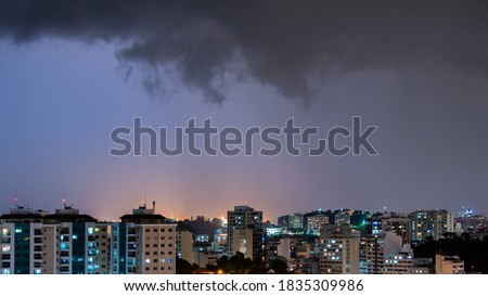 Images of the arrival of a strong summer storm with lightning and rain. Event in the city in the late afternoon, early evening in Niterói, Rio de Janeiro, Brazil