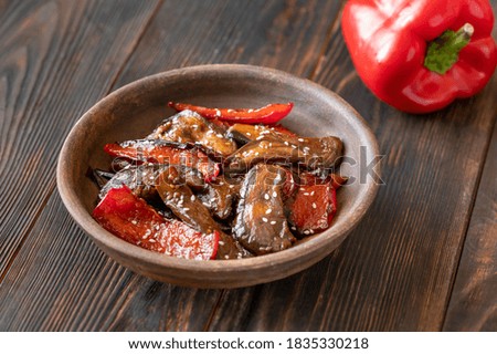 Portion of eggplant pepper teriyaki stir-fry