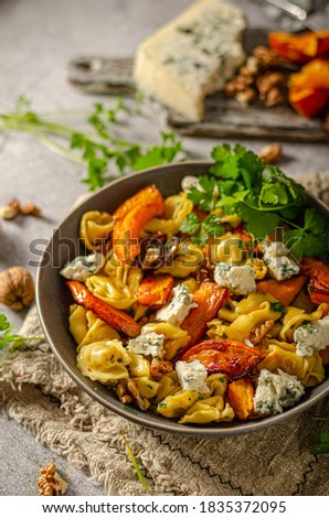 Delicious and tasty pasta, roasted pumpkin and sharp blue cheese