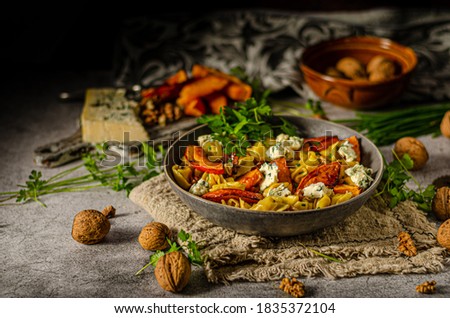 Delicious and tasty pasta, roasted pumpkin and sharp blue cheese
