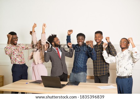 beautiful young african people in office with hand gesture