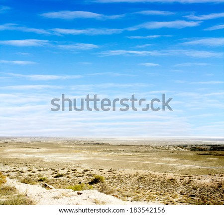  desert  against a blue sky with clouds