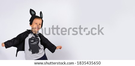 Happiness for children. Funny halloween. Cute bat smiling is preparing for Halloween, photo on a white background with plenty space. Banner- long format