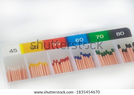Endodontics Gutta-percha cones on white background with selective focusing and negative space Royalty-Free Stock Photo #1835454670