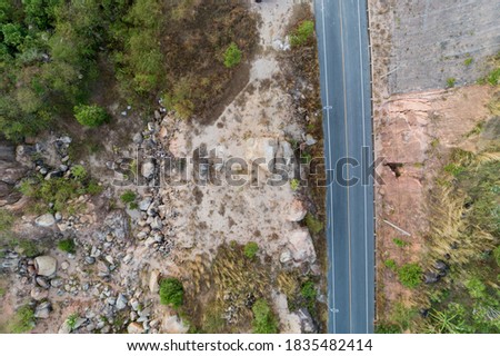 Asphalt road curve on high mountain image by Drone top down High angle view