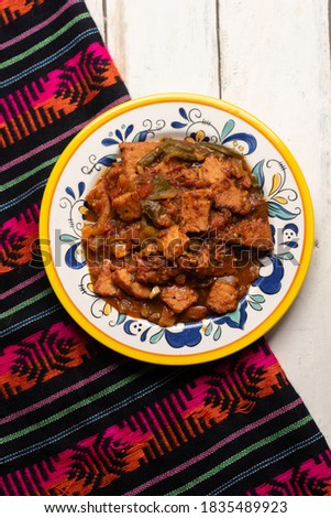 Traditional pork chops with red sauce also called mexicana style on white background