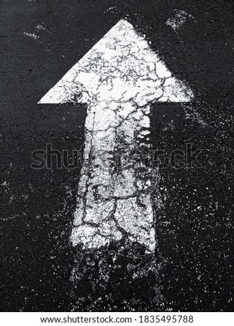 white arrow on the road