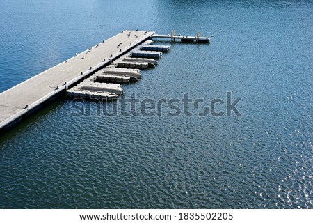 Empty marina in the port, sunny day, dark water, Montreal, Canada Royalty-Free Stock Photo #1835502205