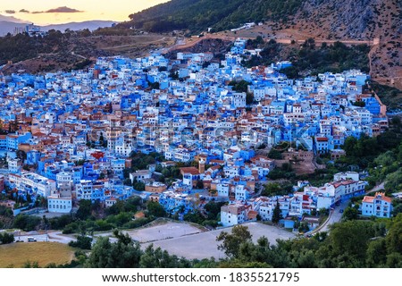 Aerial view of Chefchaouen in Morocco. The city is noted for its buildings in shades of blue and that makes Chefchaouen very attractive to visitors. Royalty-Free Stock Photo #1835521795