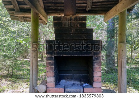 Small oven outside under a canopy for cooking