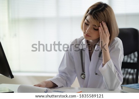 Beautiful Asian doctor, she is stressed