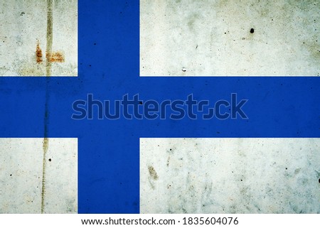 Finland flag on a concrete wall. Flags