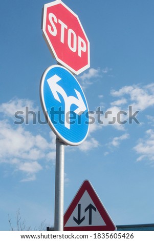 red stop sign in traffic, signaling the driver to completely stop