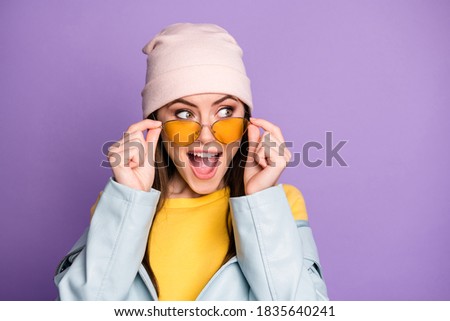 Portrait of astonished positive crazy youngster girl look copyspace, see incredible novelty impressed shout wear casual modern style clothes isolated over violet color background