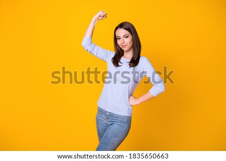 Photo of cool confident girl feel pride about her gym exercise show muscles, wear good look clothes isolated over vibrant color background