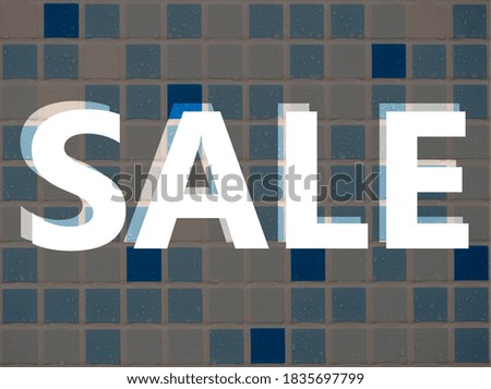 "Sale" sign against a wall of blue, blue and white tiles with water droplets on the surface.
