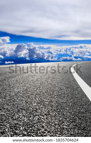 New asphalt road and green mountain with sky cloud natural scenery.