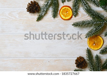 Christmas background, concept of natural ingredients and healthy food, dried oranges, spruce or pine branch and cones