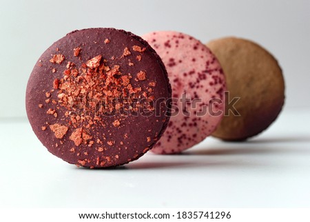 Photo of a multicolored French pastry on a white background. Macaroon cake.
