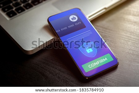 Mobile Payment and online shopping via virtual mobile banking. Pay wireless by credit bank card via electronic wallet or m-banking app. Smart phone with payment confirmation on the screen. Royalty-Free Stock Photo #1835784910