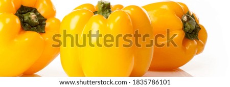 Food banner concept, organic vegetables and ingredients: close up of organic bell peppers isolated on white background