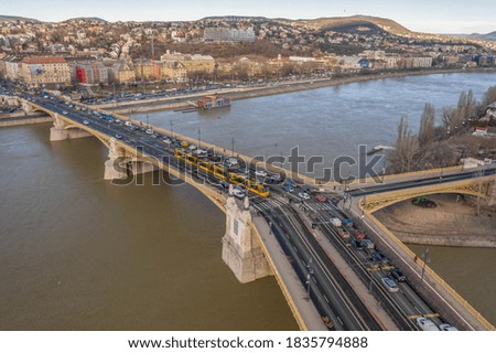 Aerial drone shot of Margret Bridge over Danube in Budapest winter morning with overcast