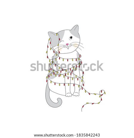 Christmas cat. Merry Christmas. Cat on an isolated white background. The kitten is entangled in the garlands. 
