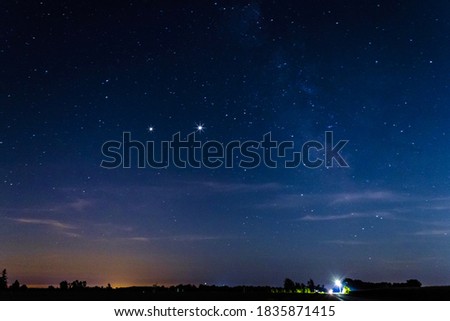 The Milky Way and two gas giants Jupiter and Saturn setting down on the fields of Leamington ON Canada