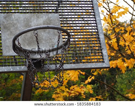 Basketball net in a school yard during autumn half term holidays