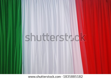 
green, white and red hanging drapes that form the Italian flag