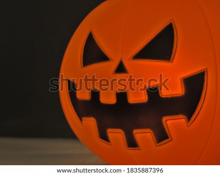 Close up view of scary Halloween pumpkin lantern for halloween party night with black background. Selective focus